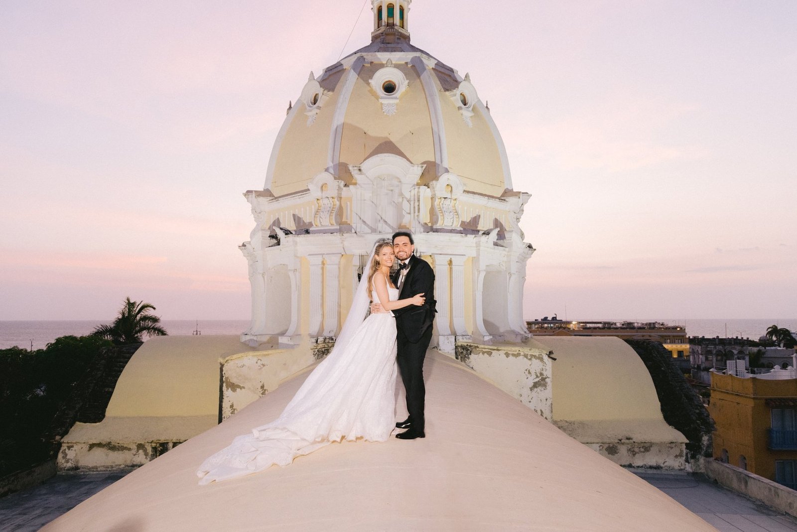 Sunset wedding portrait on a rooftop terrace in Cartagena, Colombia