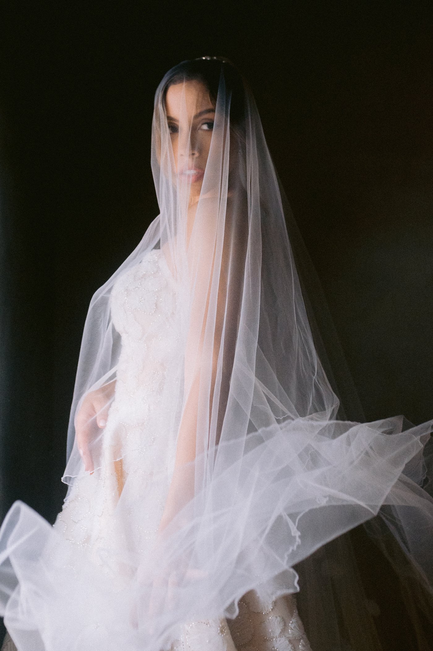 Bride's veil from behind, editorial wedding photography detail