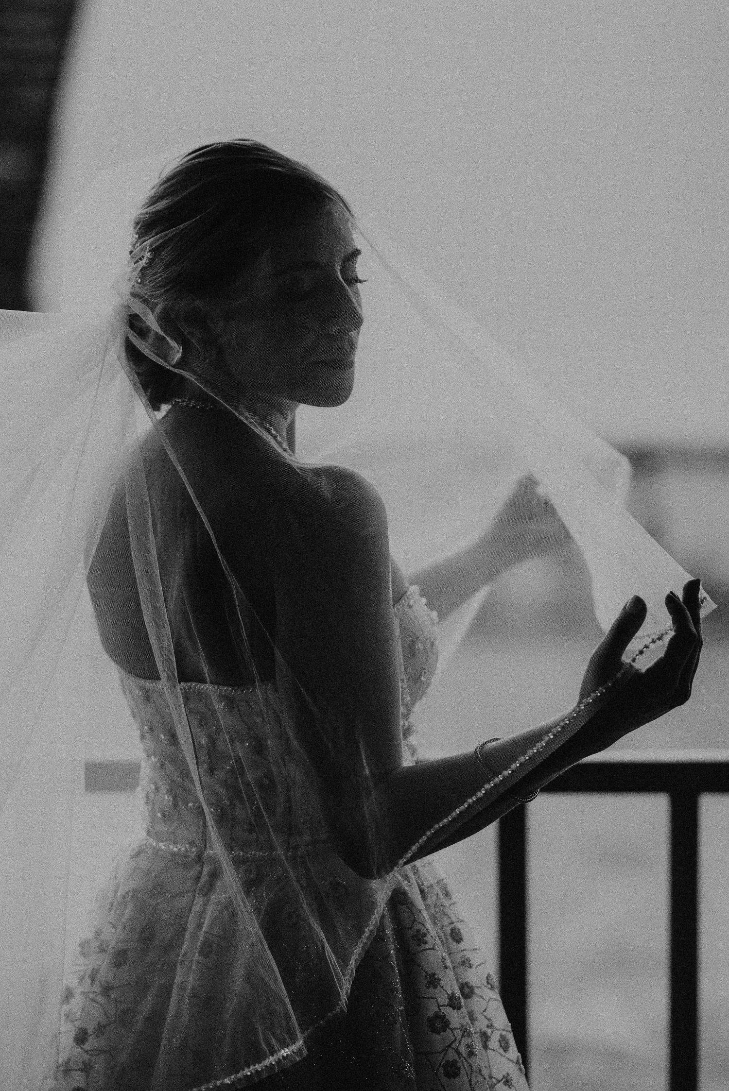 Cartagena destination wedding photographer — editorial black and white bridal portrait with veil