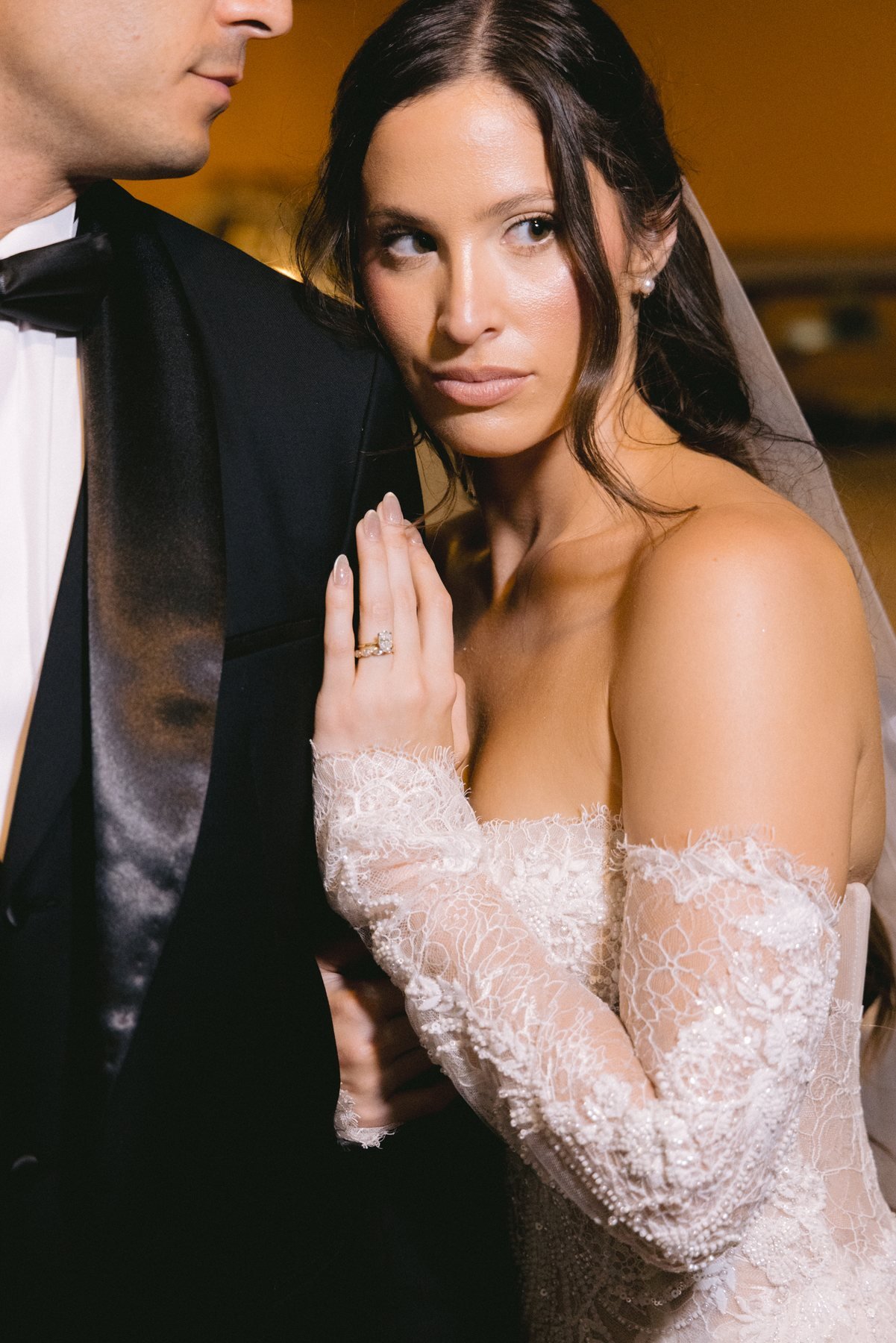 Editorial bridal portrait, bride smiling beneath a flowing veil
