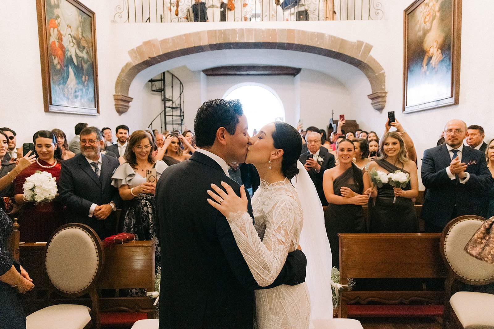 The wedding ceremony inside the church, golden altar
