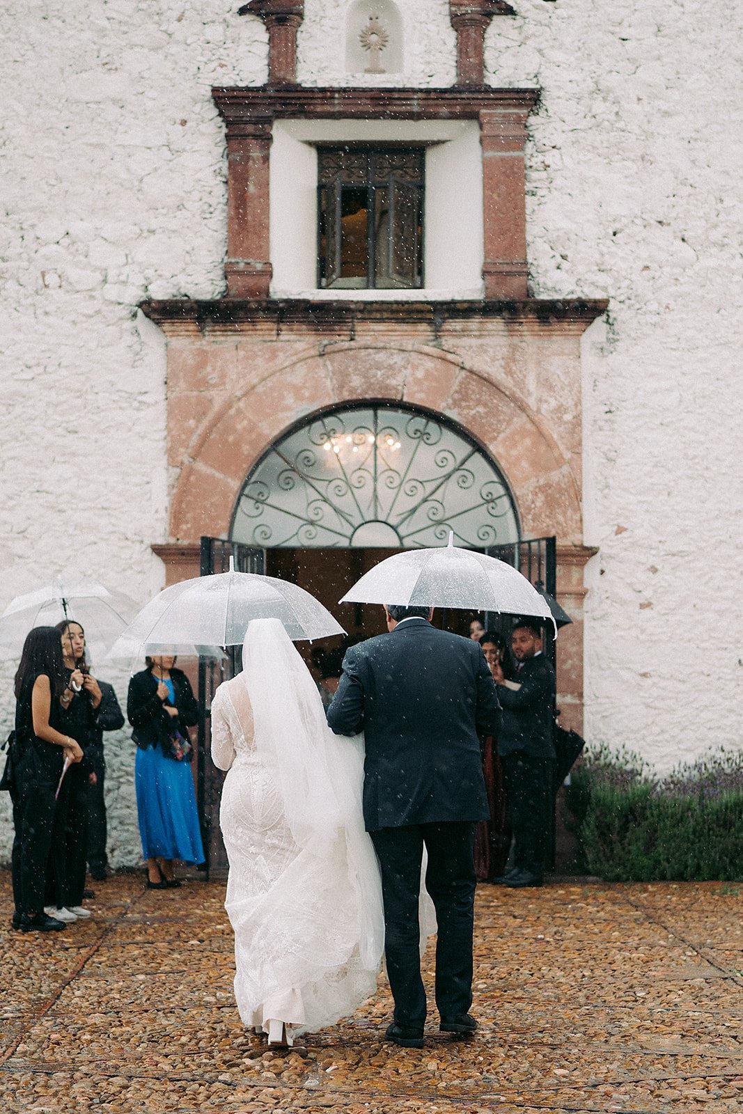 The wedding party gathered at the church entrance
