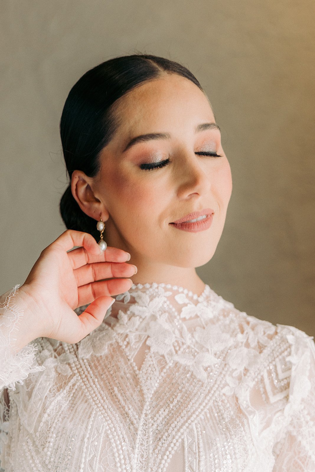 Cari, a profile portrait in her lace wedding dress