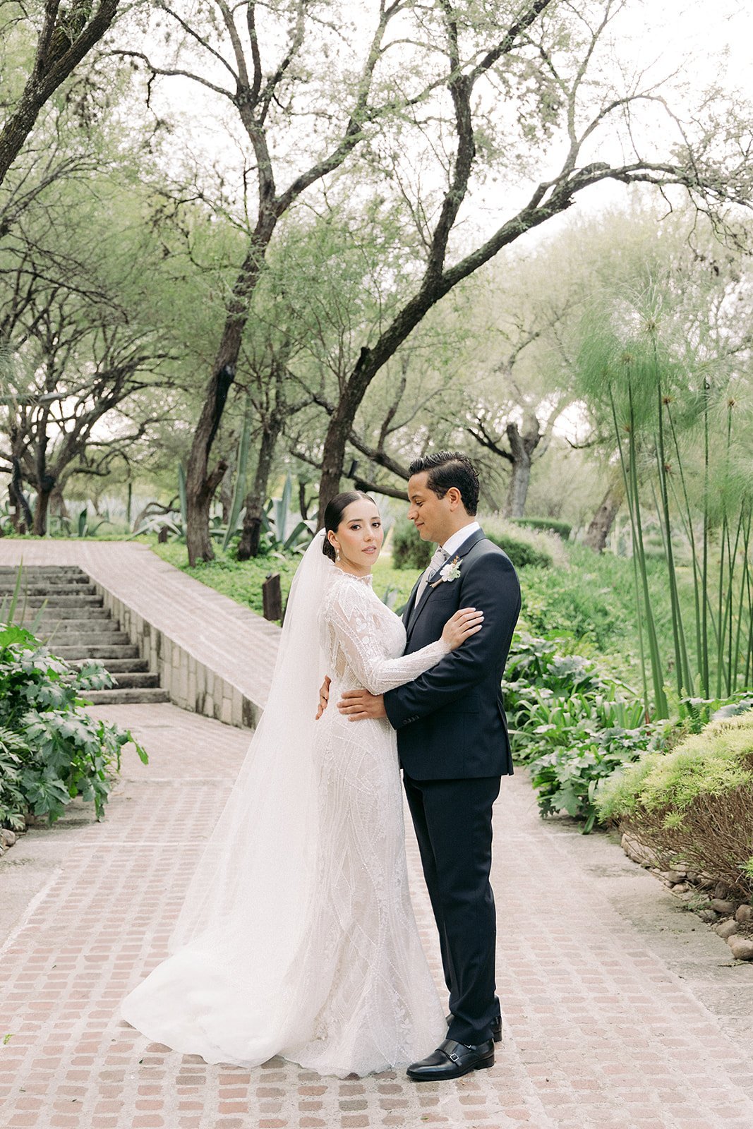 Said and Cari embracing among trees